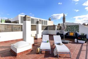 A seating area at Apartment El Confital RF18 by VillaGranCanaria