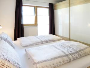 Posteľ alebo postele v izbe v ubytovaní Apartment Gitti by Interhome