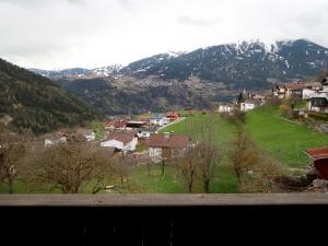 a view of a village with a snow covered mountain at Apartment Susanne by Interhome in Kauns