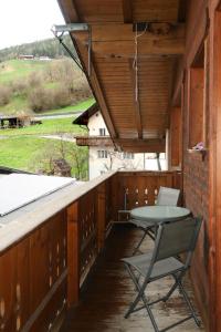 a table and a chair on the porch of a cabin at Apartment Susanne by Interhome in Kauns