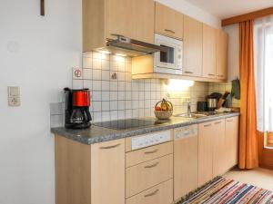 A kitchen or kitchenette at Apartment Bergfeld-2 by Interhome