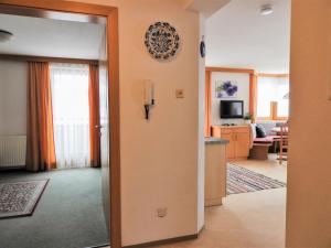 A television and/or entertainment centre at Apartment Bergfeld-2 by Interhome Még 24 kép