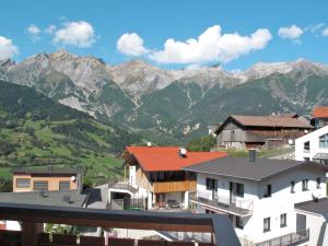 a view of the mountains from our apartment building at Apartment Tyrol - TDL125 by Interhome in Tobadill
