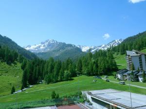 a view of a valley with snow capped mountains at Apartment Rosablanche D32 by Interhome in Siviez