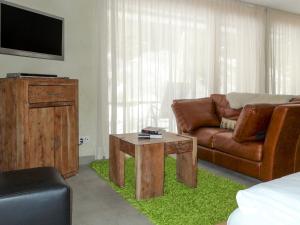 a living room with a couch and a coffee table at Apartment Rütschi-3 by Interhome in Zermatt