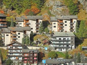 a group of apartment buildings on a mountain at Apartment Bodmen A by Interhome in Zermatt