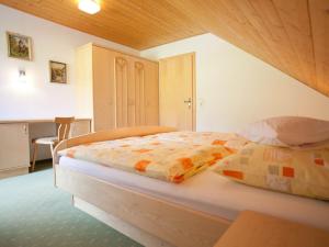 a bedroom with a bed in a room at Apartment Salzmannhof - RMU210 by Interhome in Ramsau am Dachstein