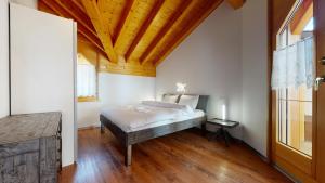 Postel nebo postele na pokoji v ubytování Villa Octogon, 2 Bedrooms, ideally located in Leukerbad