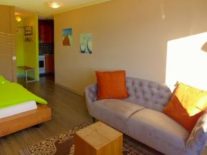 a living room with a couch and a table at Apartment Jeanne D'Arc Apt- C-28 by Interhome in Crans-Montana