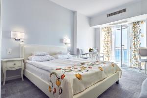 Кровать или кровати в номере Continental Forum Constanta