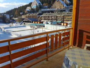 a balcony with a view of a ski resort at Apartment Farinet B 21 by Interhome in Crans-Montana
