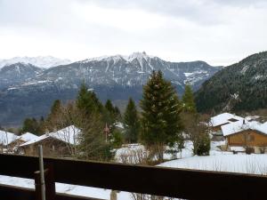 a view of a snow covered mountain range from a house at Apartment Centaure B RS 2 by Interhome in Ovronnaz