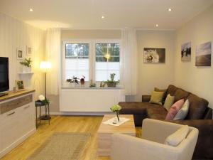 a living room with a couch and a window at Apartment Hannelore-1 by Interhome in Bübbens