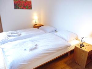 Кровать или кровати в номере Apartment Tourbillon B 27 by Interhome