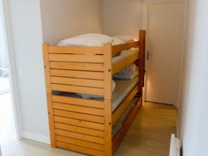 a bunk bed in a room with a bunk bed in a room at Apartment Isabelle-1 by Interhome in Cabourg +11 photos