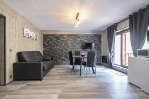 a living room with a couch and a table at Vall d'Incles TOP NATURE, A13, HUT 5836 in Canillo