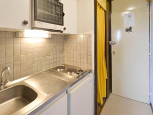 A cozinha ou kitchenette de Apartment Plagne Centre 2 - LAP172 by Interhome