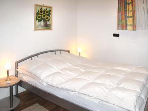 Postel nebo postele na pokoji v ubytování Holiday Home Paula by Interhome