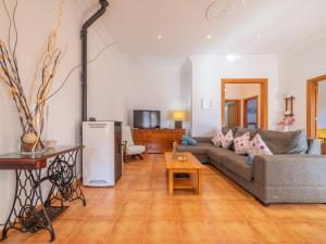 a living room with a couch and a table at Holiday Home Morla by Interhome in Porreres