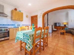 a kitchen and dining room with a table and chairs at Holiday Home Morla by Interhome in Porreres +23 photos