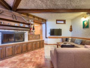 a living room with a couch and a flat screen tv at Holiday Home Jadranka by Interhome in Muntić