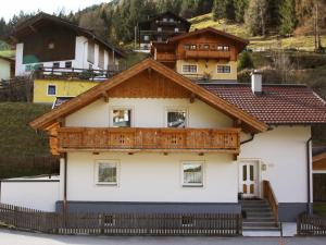 a house with a wooden roof at Apartment Haus Toferer by Interhome in Grossarl +20 photos