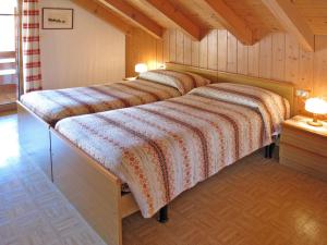 Postel nebo postele na pokoji v ubytování Apartment Lola by Interhome