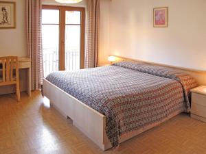 Postel nebo postele na pokoji v ubytování Apartment Lola by Interhome