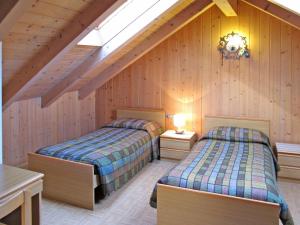 Postel nebo postele na pokoji v ubytování Apartment Lola by Interhome