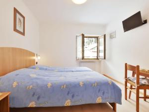A bed or beds in a room at Apartment Bernard-3 by Interhome