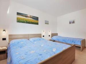 A bed or beds in a room at Apartment Bernard-3 by Interhome
