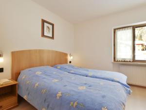 A bed or beds in a room at Apartment Bernard-3 by Interhome