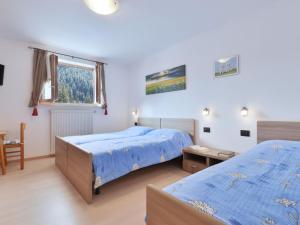 A bed or beds in a room at Apartment Bernard-3 by Interhome