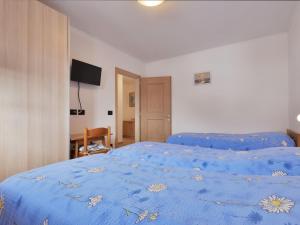 A bed or beds in a room at Apartment Bernard-3 by Interhome