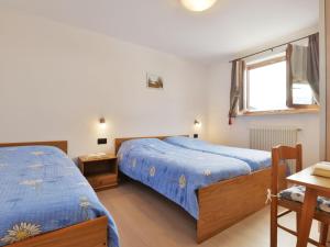A bed or beds in a room at Apartment Bernard-3 by Interhome