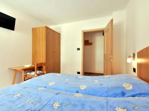 A bed or beds in a room at Apartment Bernard-3 by Interhome