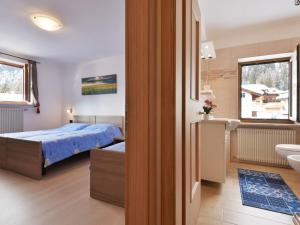 A bed or beds in a room at Apartment Bernard-3 by Interhome