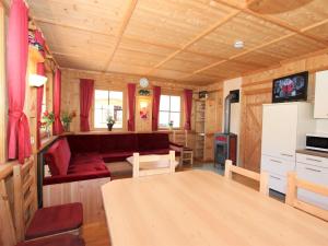 a living room with a couch and a table at Holiday Home Schwendau-2 by Interhome in Hippach