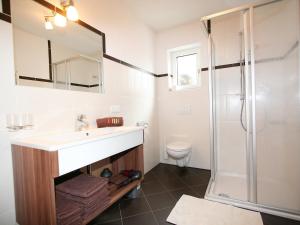 a bathroom with a sink and a shower at Apartment Venet by Interhome in Fliess