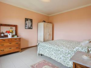 A bed or beds in a room at Holiday Home Agrumi by Interhome
