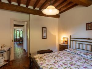 a bedroom with a bed and a hallway with a table at Holiday Home Il Sorbino by Interhome in Fondaccio +22 photos