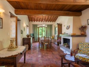 a living room with a couch and a fireplace at Holiday Home Il Sorbino by Interhome in Fondaccio