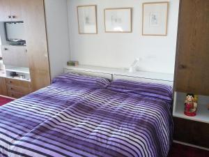 Una cama o camas en una habitación de Apartment Yuca B-3 by Interhome