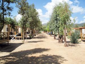 a dirt road with trees in a village at Holiday Home 4 Mori- Deluxe - MUV105 by Interhome in Muravera