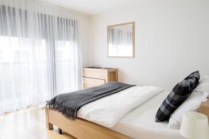 Postel nebo postele na pokoji v ubytování Nest - Voltastrasse