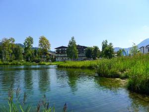 a river with houses in the middle of a town at Apartment La Riva by Interhome in Laax