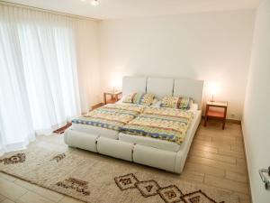 Postel nebo postele na pokoji v ubytování Apartment Hegglistrasse 9-2 by Interhome