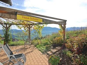 a patio with a sign that reads hrh school at Chalet The Schatzie by Interhome in Egg