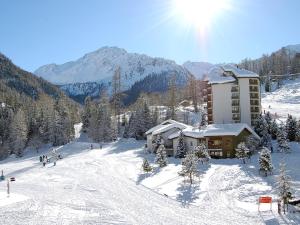 a building on a ski slope in the snow at Apartment Rosablanche A24 by Interhome in Siviez