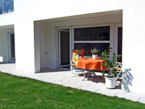 a patio with a table and chairs on it at Apartment Willmann by Interhome in Eisenbach